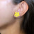 Pop-Up Mākeke - Ohana Expressions - Single Pakalana Stud Earrings - Yellowish Orange - In Use
